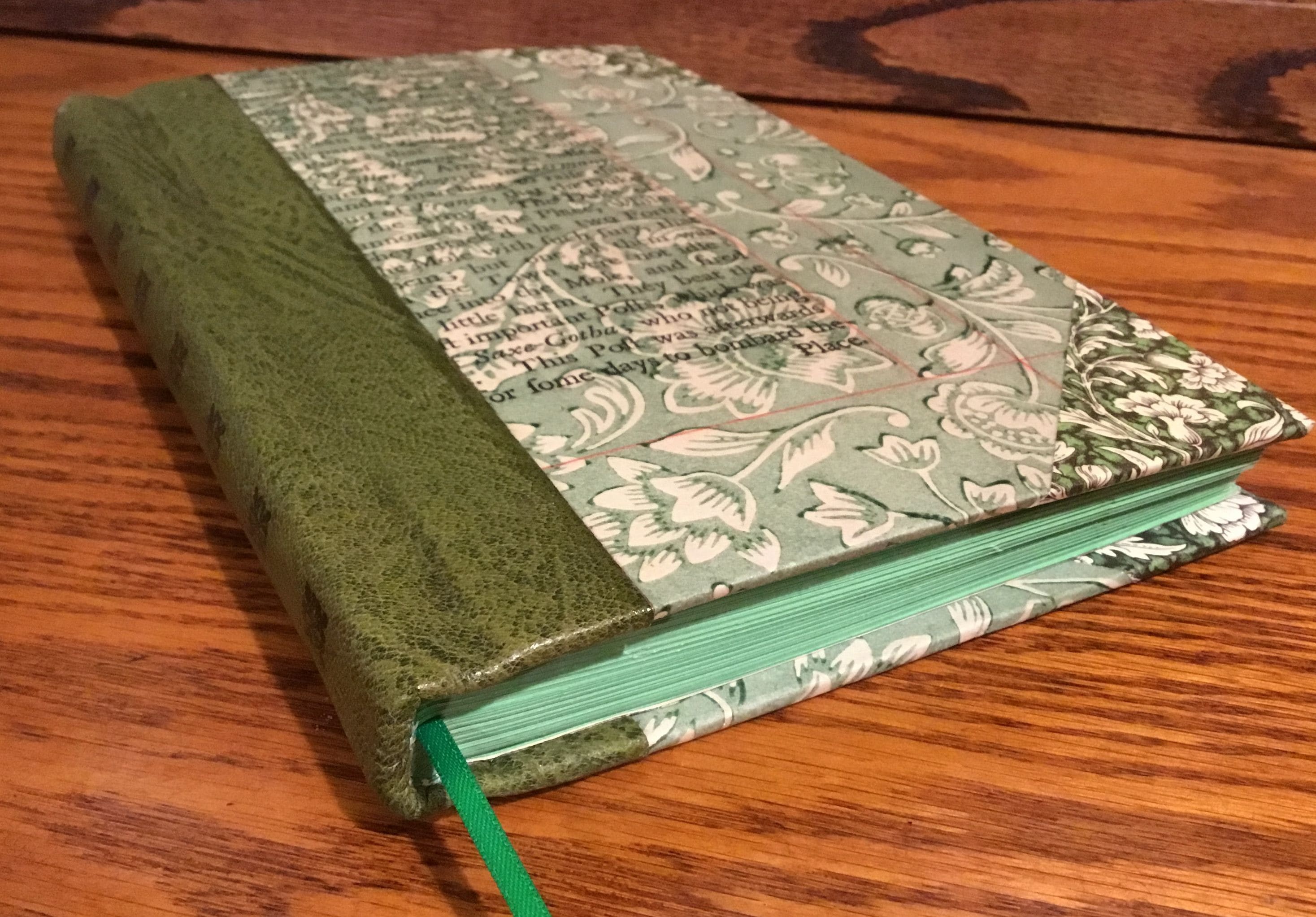 Pages washed, dried and restitiched. Full red chieftan goat, raised bands, holly spine inlay with feathered marbled paper slipcase and matching endpapers.