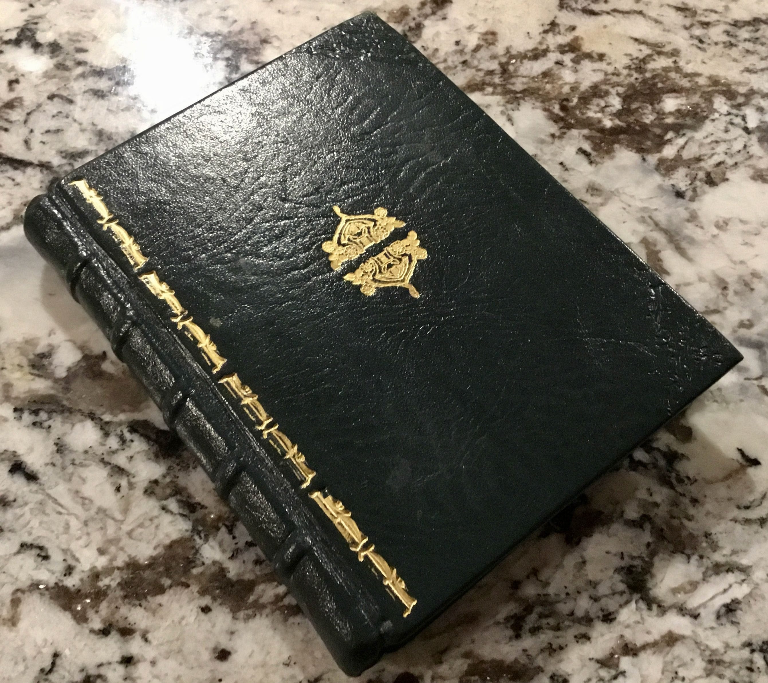 Two volume Chronicles of the March Family with original label exposed through Dodin Marbled Paper complimentary to dust jackets publisher label